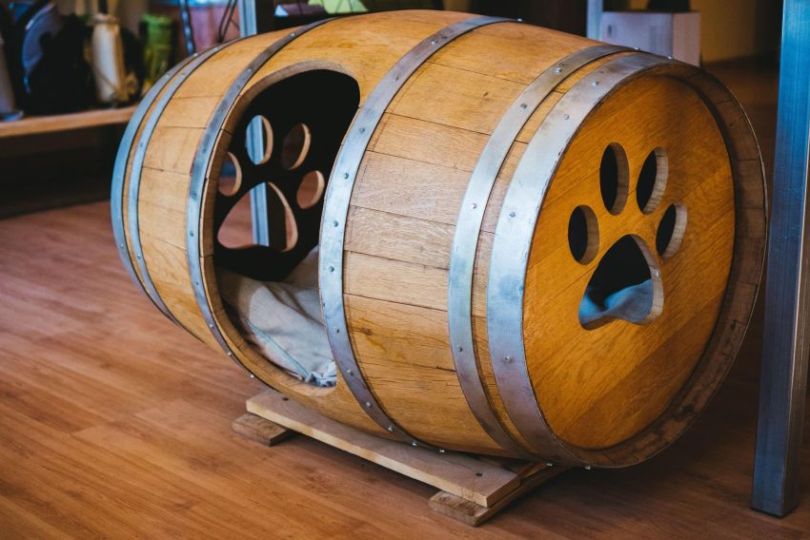 Recycled Wine Barrel Dog House With Special Paw Details recycled-wine-barrel-dog-house-with-special-paw-details
