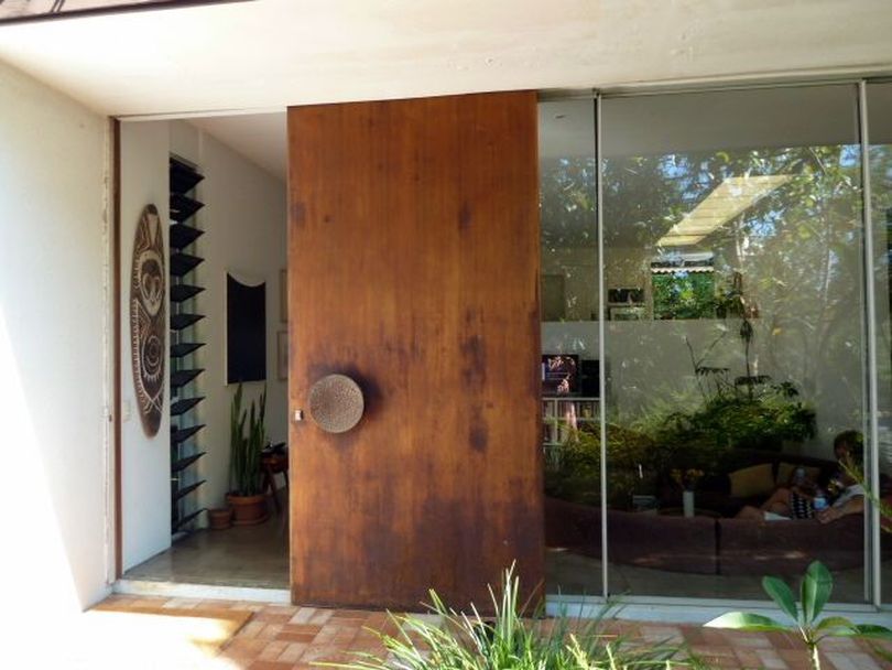 Huge Glass Walls with Sliding Wooden Door