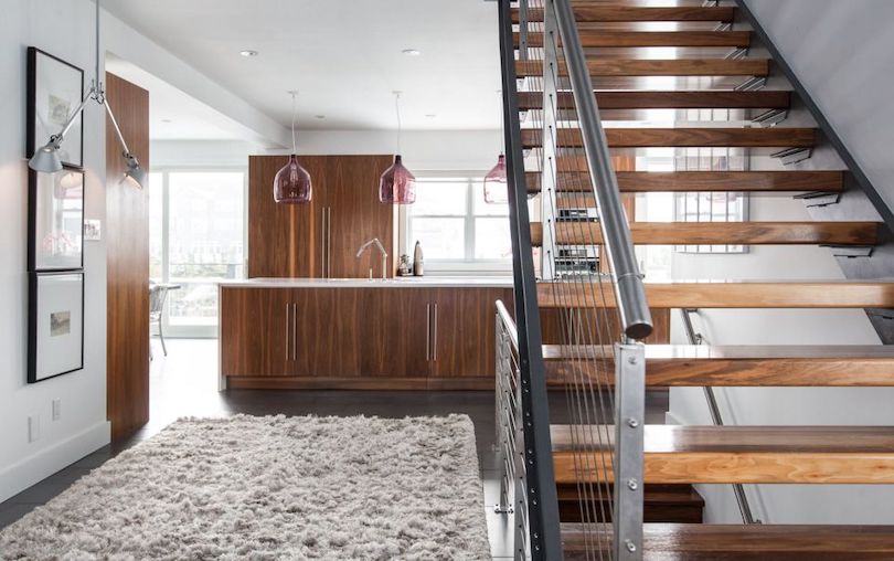 Open Modern Staircase With Black Metal Baluster and Wire Railing