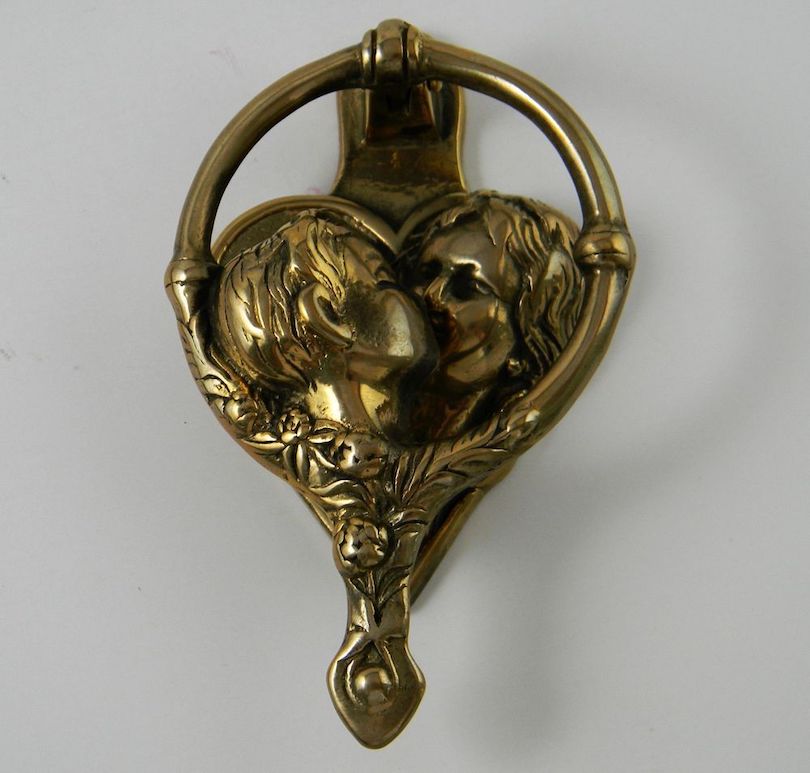 Lacquered brass kissing cherubs door knocker