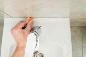 how to remove caulk from shower
