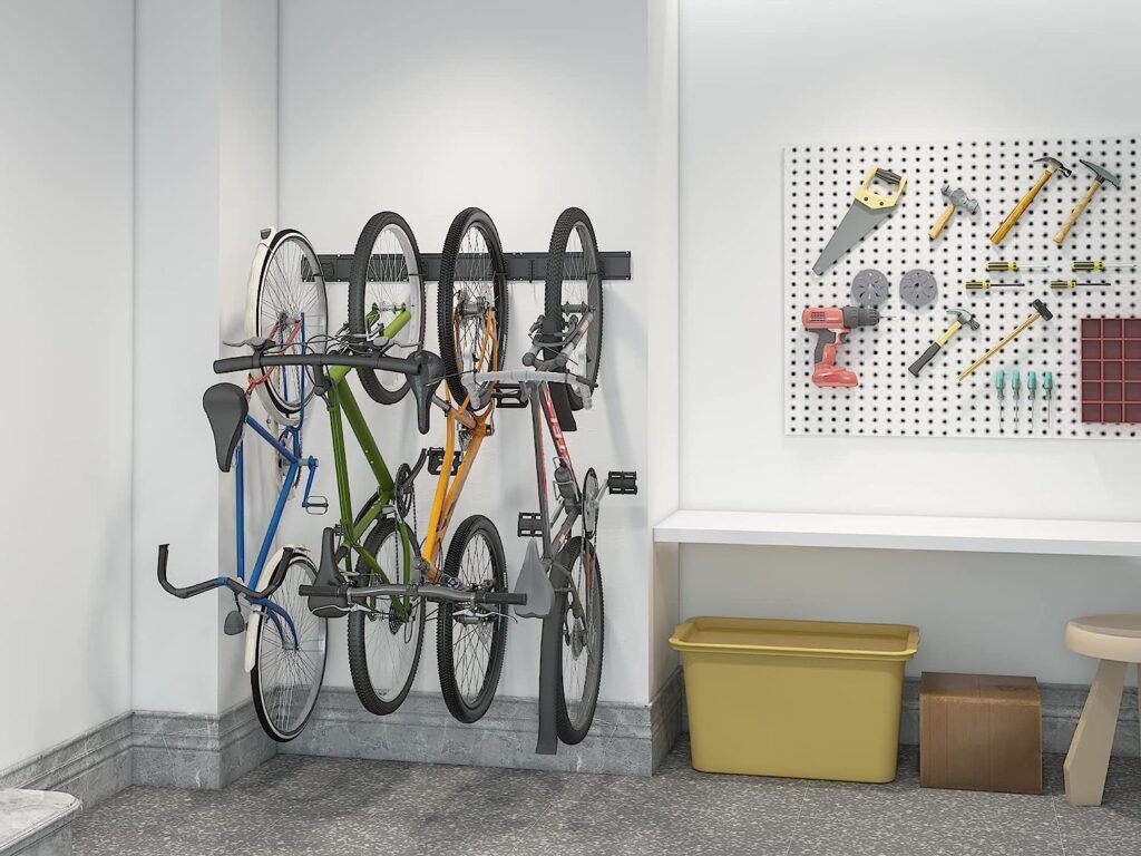 Pegboard gear station beside garage bikes with helmet, pump, lock, lights and tool bin